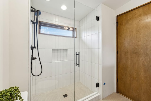 bathroom with a shower stall