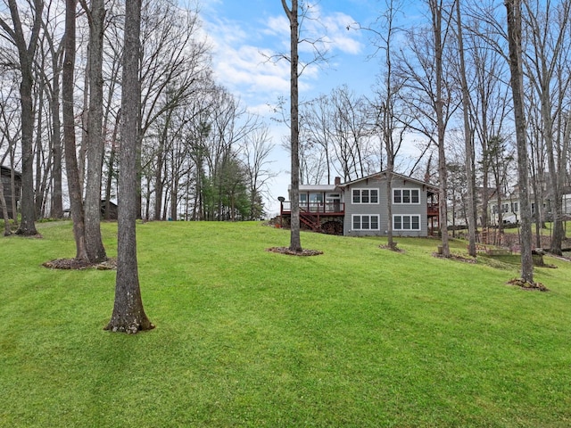 view of yard featuring a wooden deck