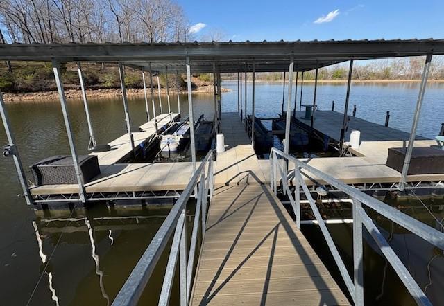 dock area featuring a water view and boat lift