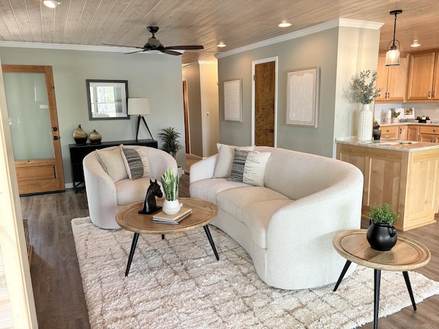 living room featuring ornamental molding, wood finished floors, and recessed lighting