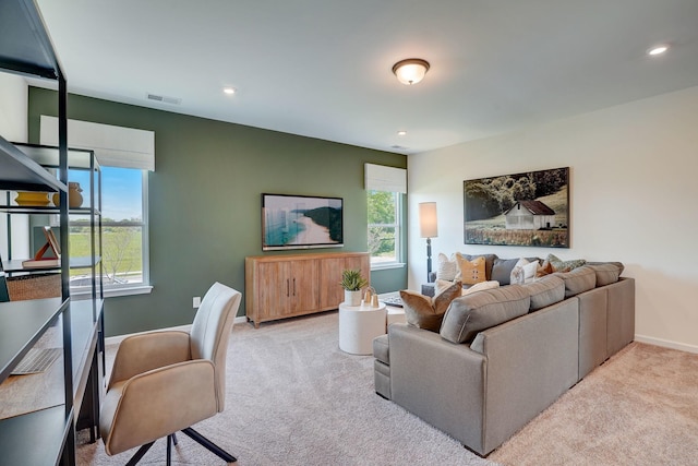 living room featuring visible vents, baseboards, carpet flooring, and recessed lighting