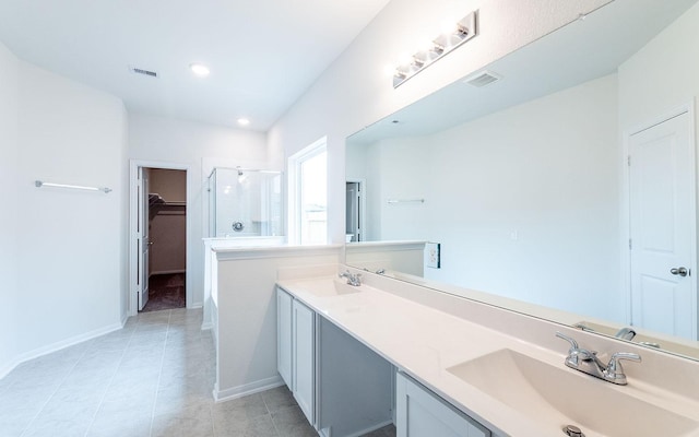 full bath with a shower stall, visible vents, and a sink