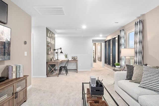 living room with light carpet, recessed lighting, visible vents, and baseboards