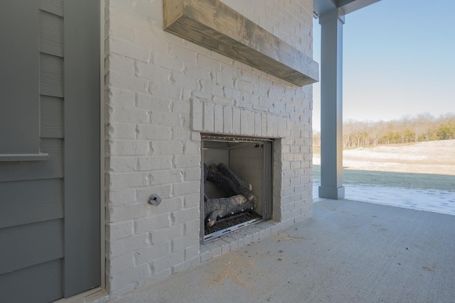 room details with an outdoor brick fireplace