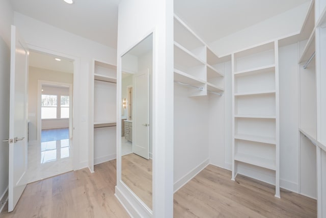 spacious closet with wood finished floors