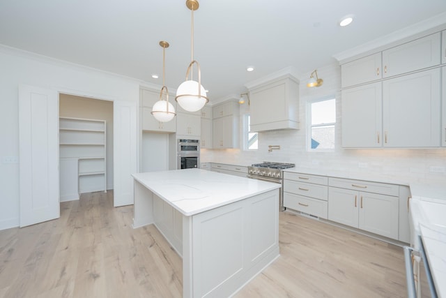 kitchen with appliances with stainless steel finishes, a center island, custom exhaust hood, crown molding, and backsplash