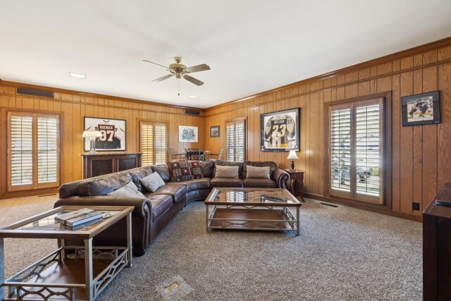 1608 Knox Dr, Brentwood, TN 37027 - carpeted living area featuring wooden walls, visible vents, crown molding, and a ceiling fan