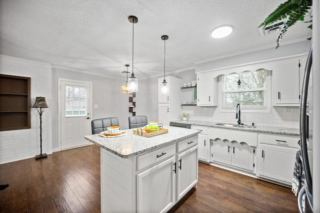 kitchen with dark wood-style floors, open shelves, a sink, and white cabinets