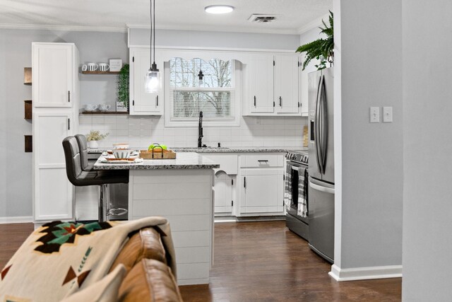 kitchen with range with electric stovetop, a sink, visible vents, white cabinetry, and open shelves