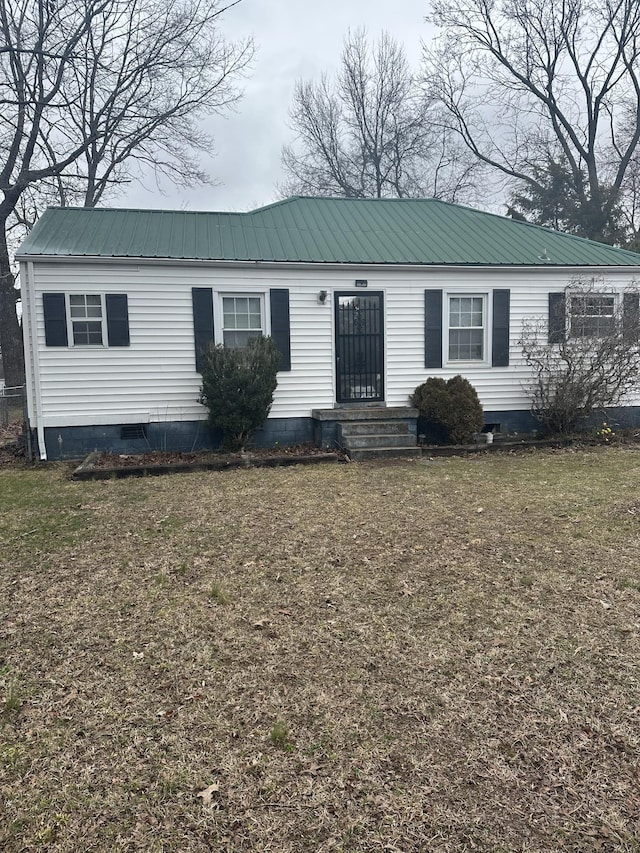 manufactured / mobile home with crawl space, a front lawn, and metal roof