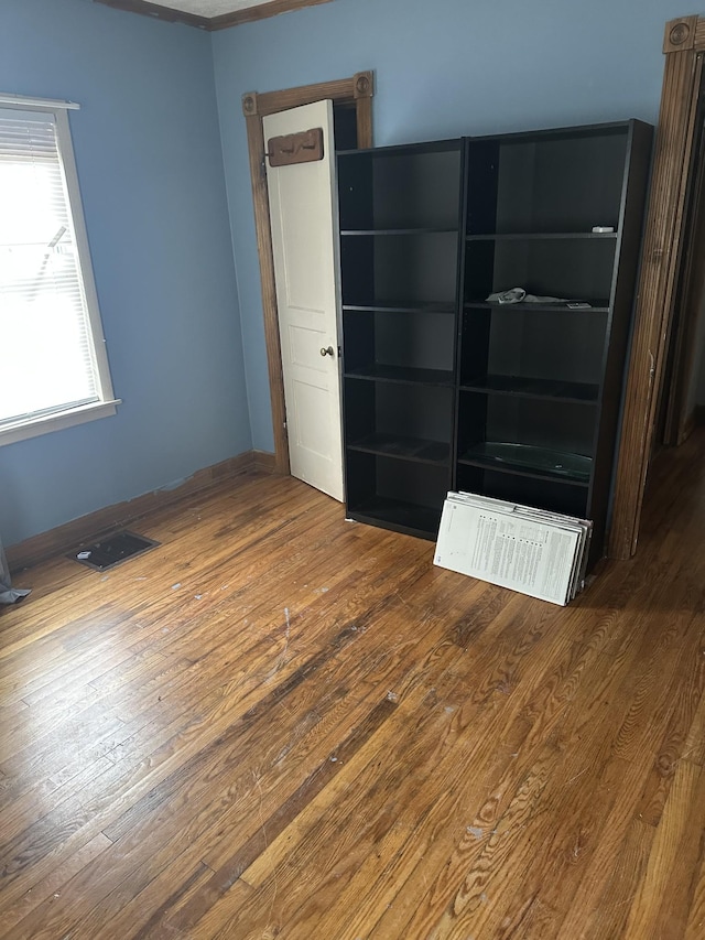 26 Central Ave, Tullahoma, TN 37388 - unfurnished room featuring hardwood / wood-style floors, baseboards, and visible vents