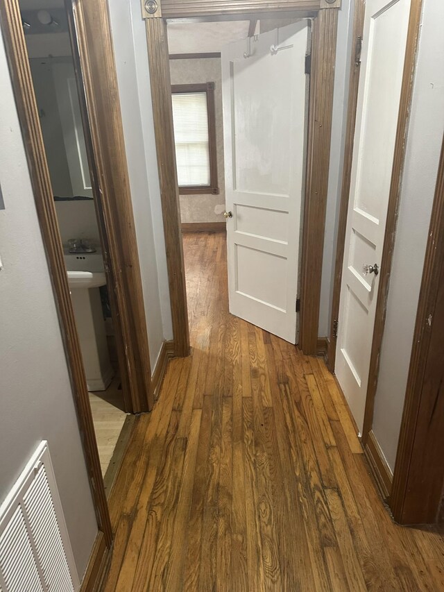 26 Central Ave, Tullahoma, TN 37388 - hallway featuring visible vents, baseboards, and wood finished floors