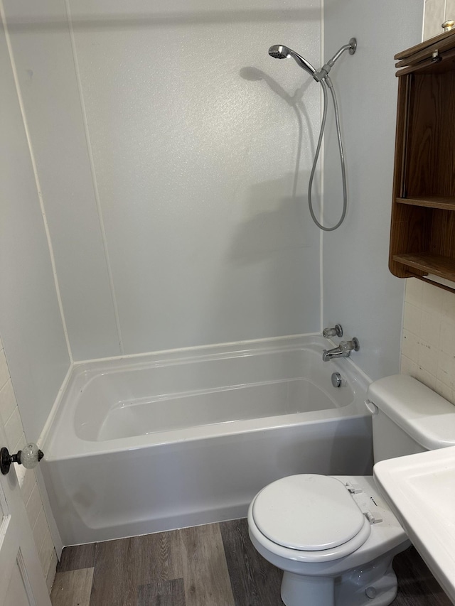 26 Central Ave, Tullahoma, TN 37388 - full bath with shower / tub combination, a sink, toilet, and wood finished floors