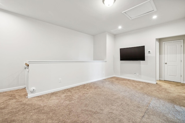 empty room with recessed lighting, carpet flooring, attic access, and baseboards