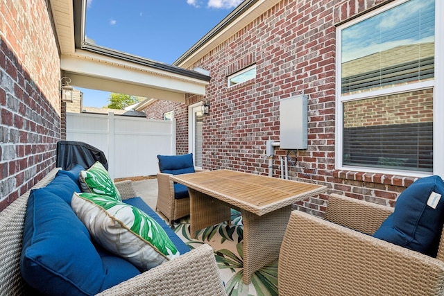 exterior space with fence and outdoor lounge area