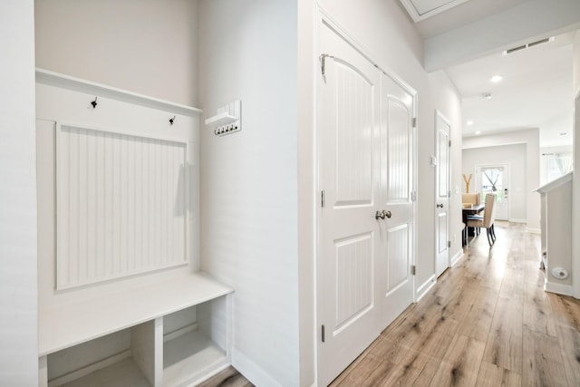 mudroom with baseboards, recessed lighting, visible vents, and light wood-style floors