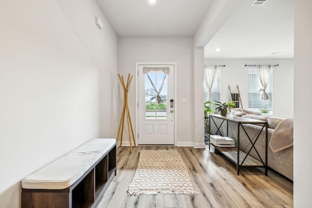 interior space featuring visible vents, recessed lighting, light wood-style flooring, and baseboards