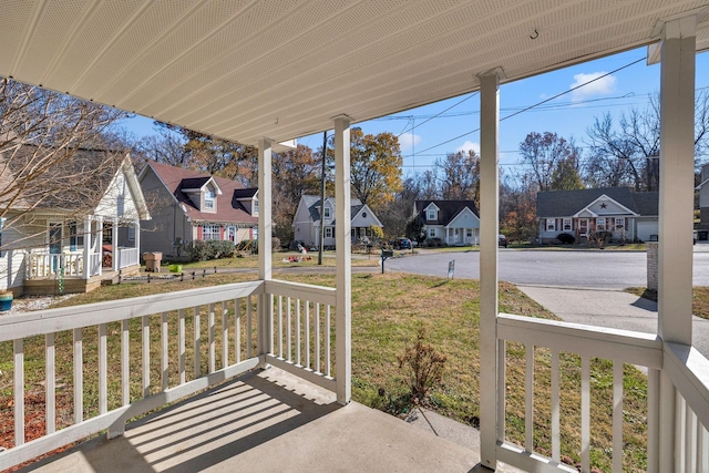 view of patio featuring a residential view and a porch