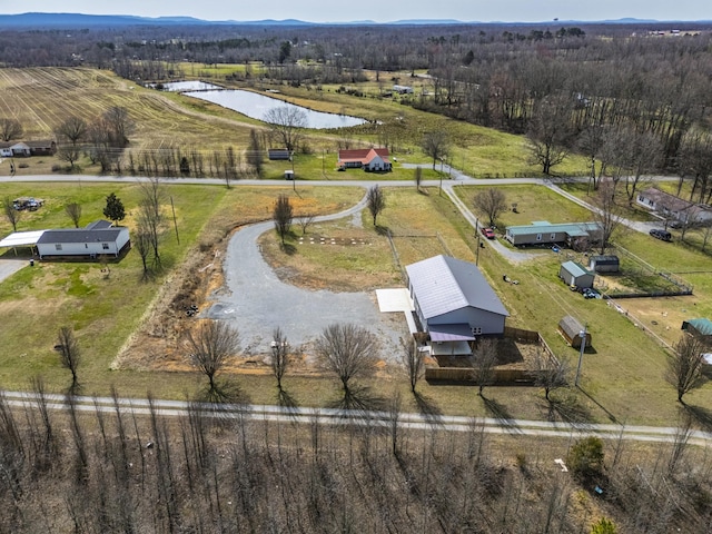 bird's eye view featuring a rural view and a water view