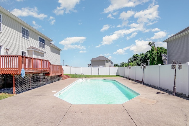 view of pool featuring a deck, a patio area, a fenced backyard, and a fenced in pool