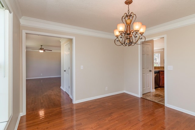 spare room featuring crown molding and wood finished floors