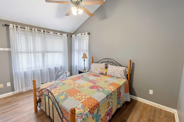 bedroom featuring ceiling fan, baseboards, vaulted ceiling, and wood finished floors