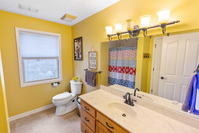 full bathroom featuring toilet, vanity, visible vents, baseboards, and a shower with curtain