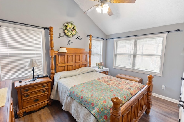 bedroom with vaulted ceiling, dark wood finished floors, a ceiling fan, and baseboards