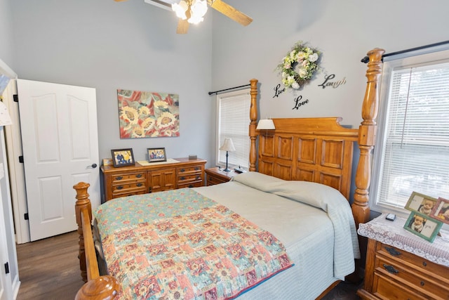 bedroom with a ceiling fan and dark wood-style flooring