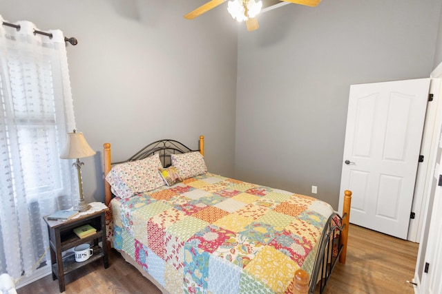 bedroom with ceiling fan and wood finished floors