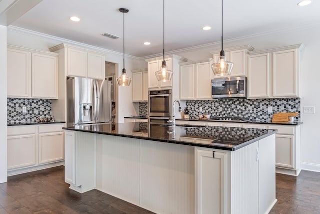 kitchen featuring visible vents, ornamental molding, dark wood-type flooring, stainless steel appliances, and a sink