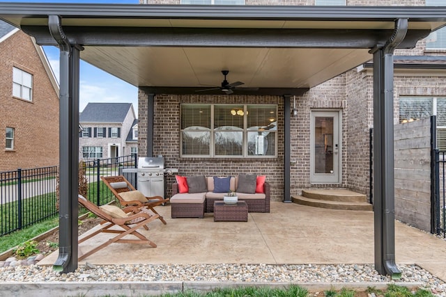 view of patio featuring outdoor lounge area, ceiling fan, area for grilling, and fence