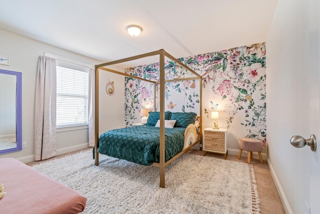 bedroom featuring carpet flooring and baseboards