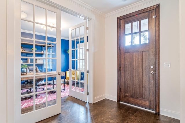 entrance foyer with crown molding, baseboards, dark wood-type flooring, and french doors