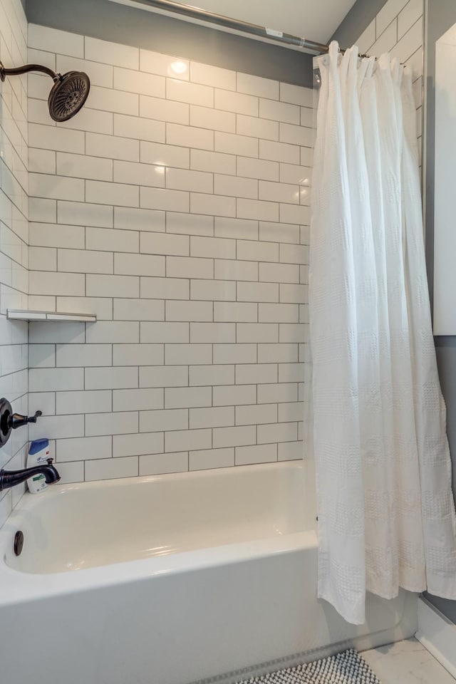 bathroom with shower / tub combo