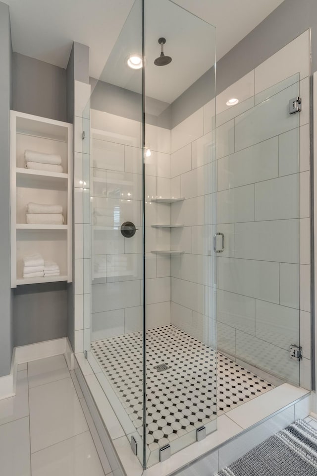 full bath featuring a stall shower and tile patterned floors