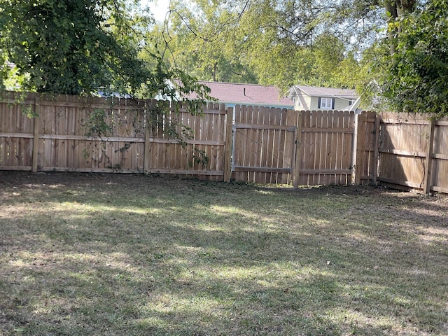 view of yard featuring a gate and fence