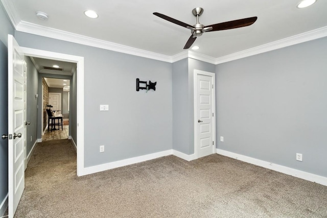 carpeted empty room featuring ceiling fan, baseboards, crown molding, and recessed lighting