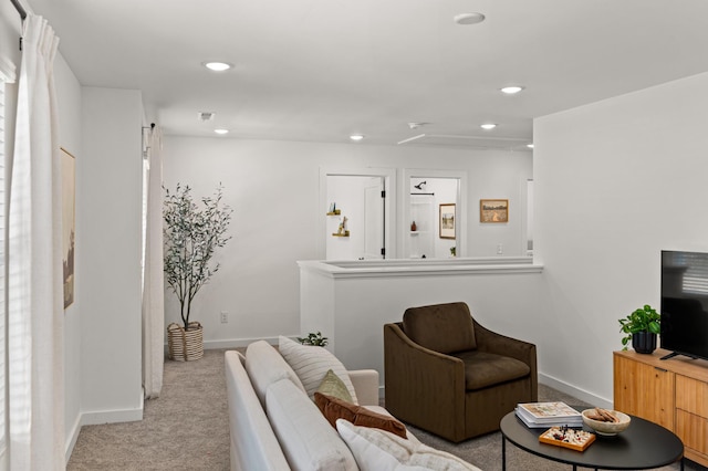 living room with baseboards, carpet flooring, and recessed lighting