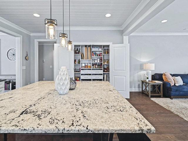 dining area with recessed lighting, dark wood finished floors, and crown molding