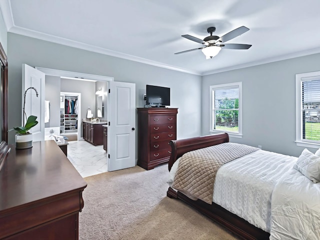 bedroom featuring connected bathroom, a ceiling fan, marble finish floor, a spacious closet, and ornamental molding