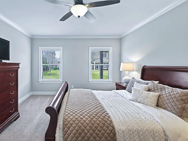 bedroom featuring a ceiling fan, carpet, crown molding, and baseboards