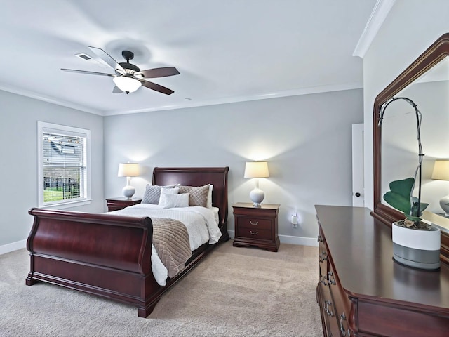 bedroom featuring baseboards, ornamental molding, and light colored carpet