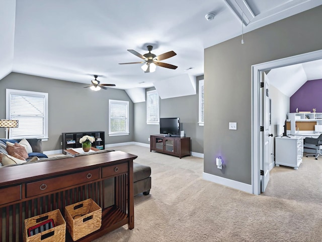 home office featuring lofted ceiling, attic access, a ceiling fan, light carpet, and baseboards