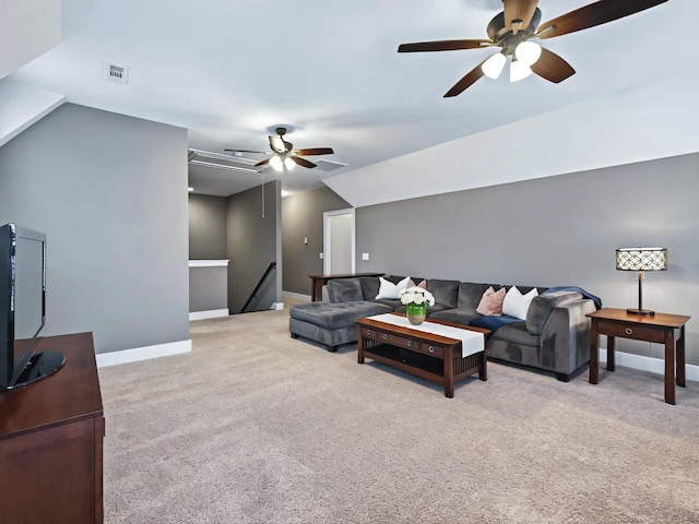 living room with carpet, attic access, visible vents, and baseboards