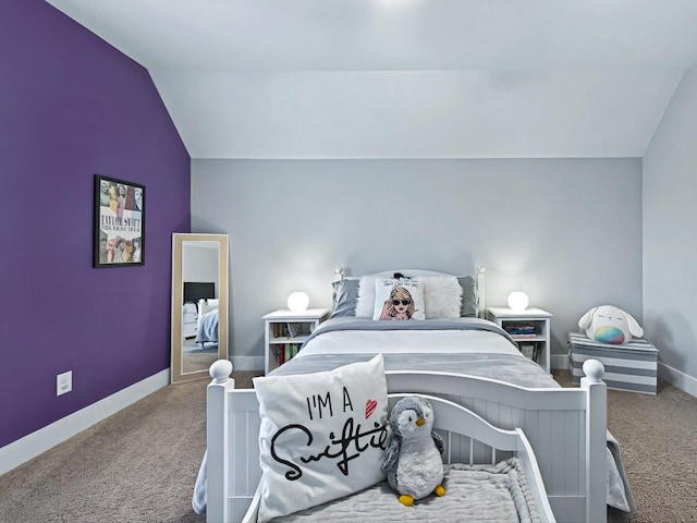 carpeted bedroom with lofted ceiling and baseboards