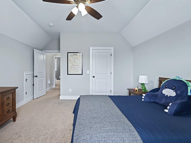 bedroom featuring lofted ceiling, ceiling fan, baseboards, and light colored carpet