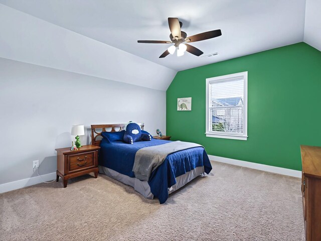 bedroom with lofted ceiling, carpet flooring, a ceiling fan, and baseboards