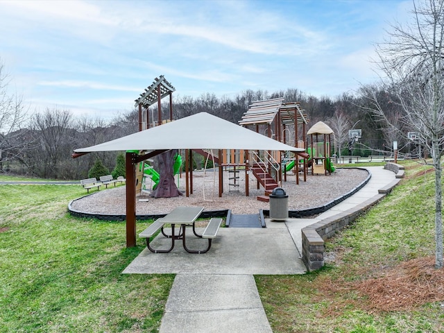 community jungle gym featuring a lawn