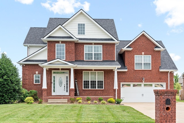 traditional-style house featuring driveway, a front yard, and brick siding